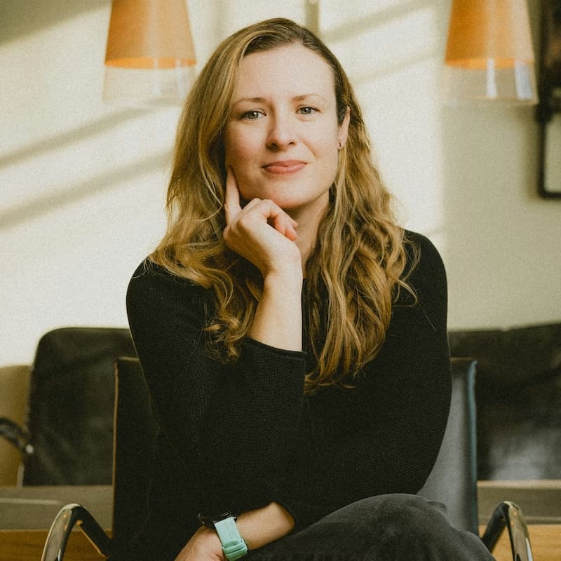 Client smiling during an online therapy session for dating and relationship support.